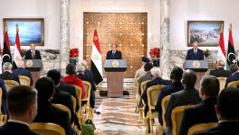 Egyptian President Abdel Fattah al-Sisi (C), flanked by Libyan commander Khalifa Haftar (R) and the Libyan Parliament speaker Aguila Saleh (L) announced a road map to end the fighting in Libya, Cairo, June 6, 2020