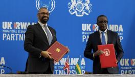 Home Secretary James Cleverly and Rwanda Minister of Foreign Affairs and International Cooperation Vincent Biruta on December 5, 2023, after signing a new Treaty that will push forwards the UK-Rwanda Migration and Economic Development Partnership. Photo: UK Government