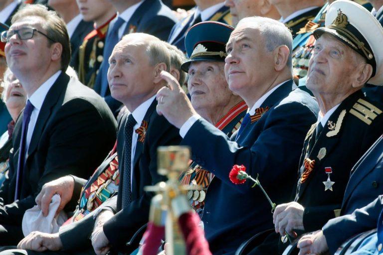 Russian President Vladimir Putin (second from left) and Israeli Prime Minister Benjamin Netanyahu watch the Victory Day military parade at Red Square,  Moscow, May 9, 2018.