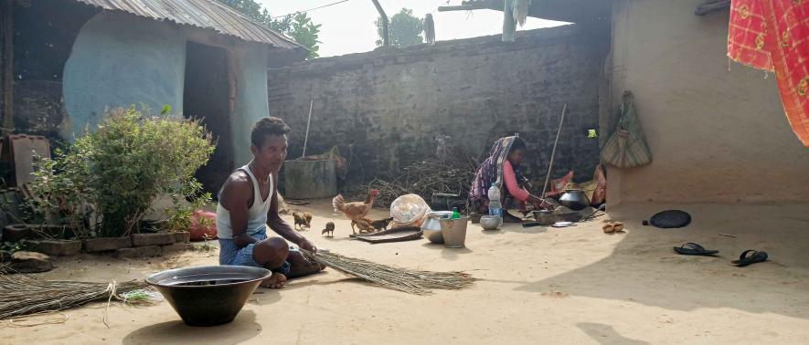  Deceased Rohan’ Sardar's grandfather Tirtha Sardar making broom in their courtyard while his grandmother Pratima is cooking  