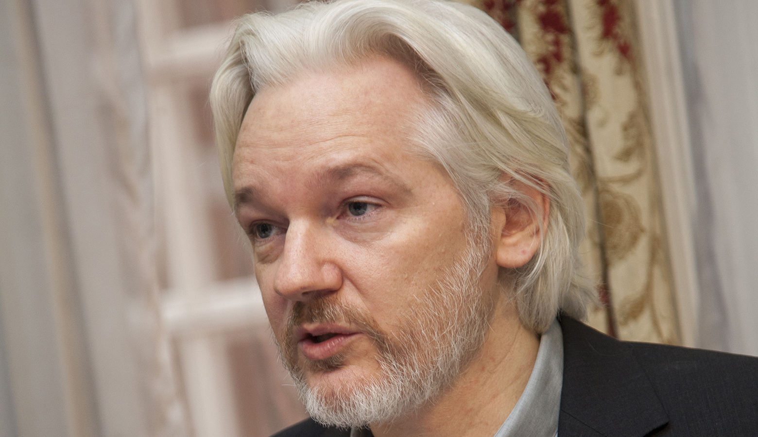 Julian Assange Appears in UK Court to Fight US Extradition Bid | NewsClick