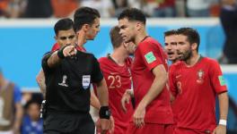 VAR penalty decision during Iran vs Portugal FIFA World Cup match.