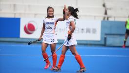 Indian women's hockey team players Lalremsiami and Monika celebrate a goal against Japan in the Olympic test event in Tokyo