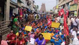 Community health workers in India blockade a road during the historic strike on November 26. Source Newsclick
