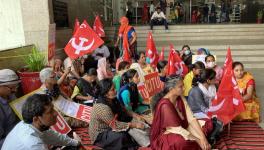 Terminated workers and helpers sat on a hunger strike outside WCD headquarters. Image credit: Ronak Chhabra