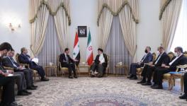 Iran’s president Ebrahim Raisi (right) in talks with visiting Syrian President Bashar al-Assad, Tehran, May 8, 2022 