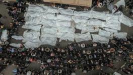 Palestinians perform funeral of victims of massacre in Rafah (Photo via Quds News Network/X)