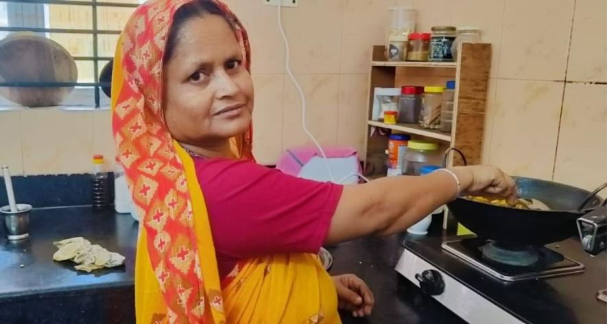 Salema Khatun, 53, from Bihagaon Chapori in Sonitpur district, Assam, cooks a meal at her workplace in Tezpur(Photo - Maitreyee Boruah, 101Reporters)