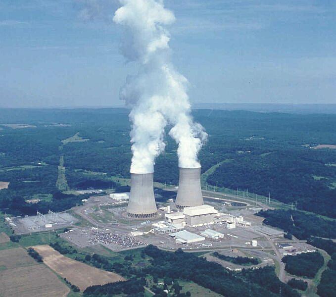 The Susquehanna Steam Electric Station, a boiling water reactor. The reactors are located inside the rectangular containment buildings towards the front of the cooling towers. The power station produces 63 million units of electricity per day.